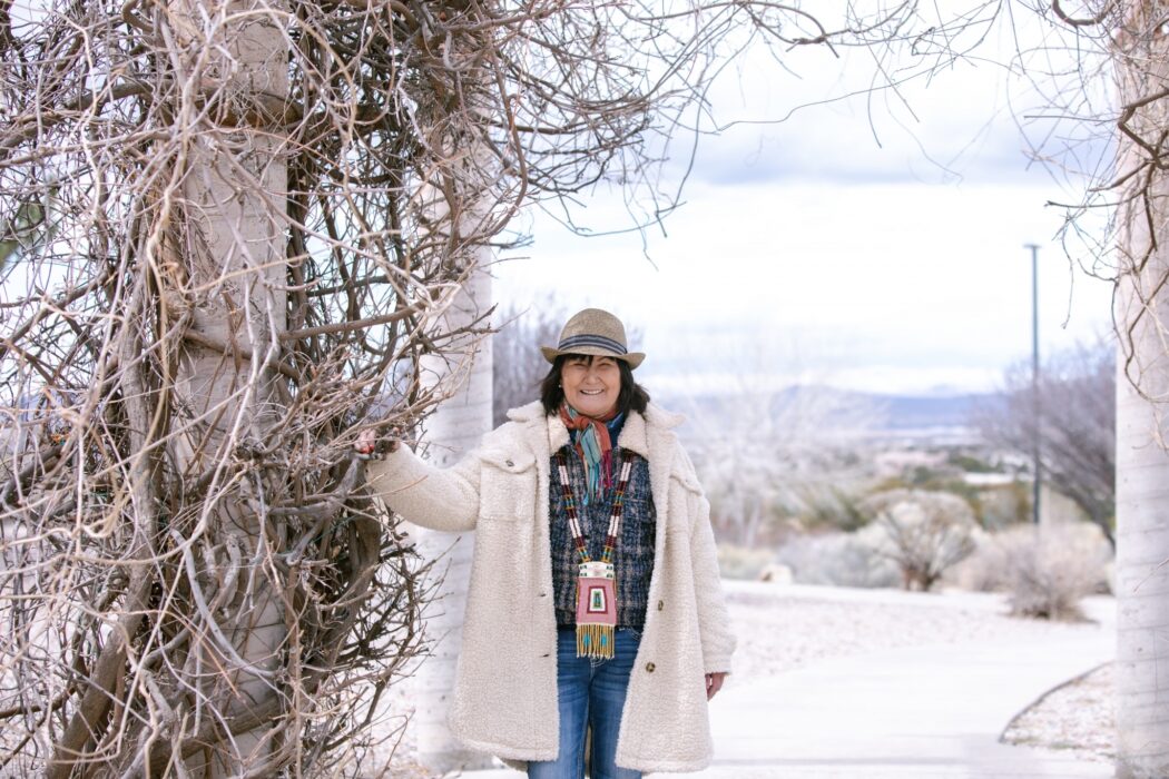 dj nanouk okpik standing near a tree