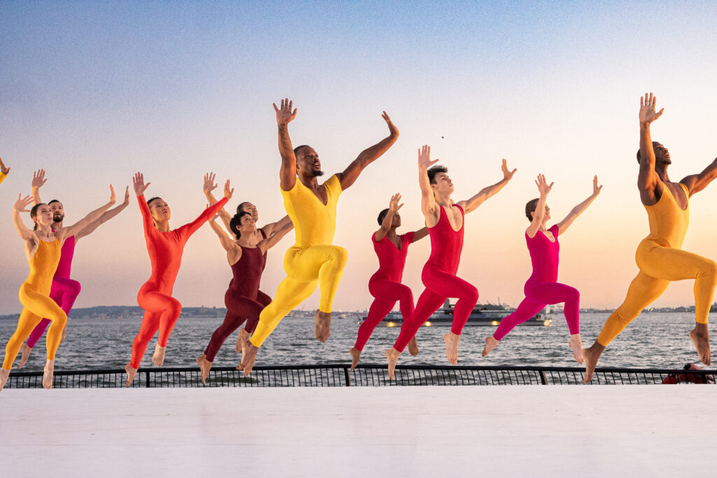 photo of several dancers in colorful costumes